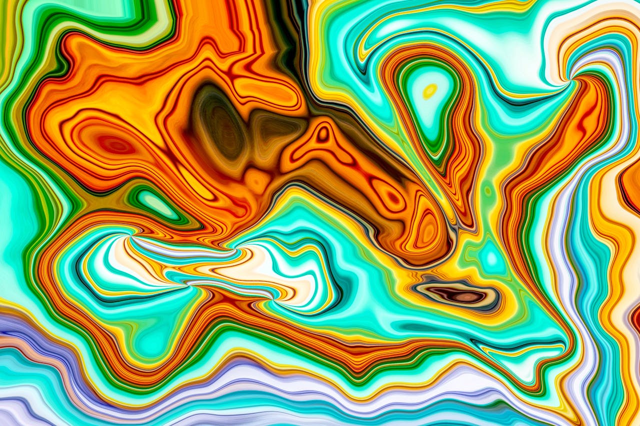 Colorful abstract art featuring swirling patterns and vibrant hues, evoking a sense of movement.